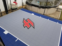 Small blue and grey basketball court in Braintree, MA, featuring a custom red H logo.