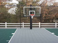 Backyard basketball court in Plymouth, MA. We could construct backyard basketball for you, too, in Sandwich, Bourne, Manoment, Cedarville, Duxbury or Osterville.