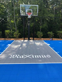 Blue and gray residential basketball court in Easton, MA.