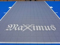 The name Maximus with crossed swords for the X, in honor of the court owner's son.