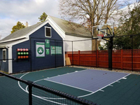 Backyard basketball court is the sort of thing you might find in Fairhaven, MA or a yard like yours. Included are customer embellishments to their court area, with basketball rack, Celtics banners, and Larry Bird shirt.