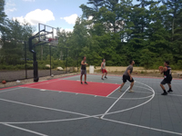 Town basketball court after complete resurfacing and renovation in Plympton, MA.