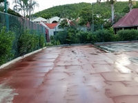 Before Caribbean tennis court restoration at Sandals Grande Antigua Resort and Spa in St. Johns, Antigua.