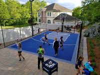 Backyard basketball volleyball multicourt in Stoneham, MA.