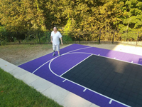 Purple and black backyard basketball court in Stoneham, MA.