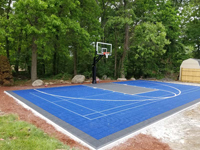Blue and charcoal home basketball court in Ashand, MA.