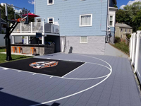 Silver and black basketball court with custom Hoop Heads logo in Boston, MA.