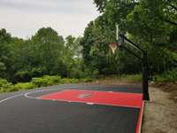 View from right to left end of black and red basketball court in Brockton, MA.
