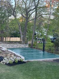 Hingham green basketball with pickleball in beautiful backyard landscape.
