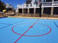 Large front yard combined hockey and basketball court in Hingham, MA.