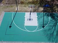 Overhead view of green and silver backyard basketball court in Reading, MA.