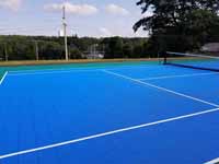Modern resurfacing of decrepit town basketball court in Middleboro, MA for tennis and pickleball, blue and green with portable net.
