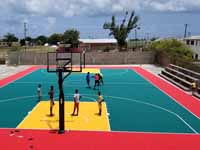 Replacement tennis and basketball courts in Codrington, Barbuda, courtesy of Australia, the Red Cross, and community effort, part of the ongoing recovery from hurricane Irma. Shown here before, with visiting goats.