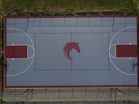 Overhead view of entire Great Horse basketball court with horse head logo in center.