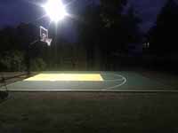 Easton, MA basketball court from left side, at night with optional lighting turned on.