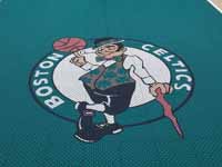 Closeup of Boston Celtics logo on emerald green background.