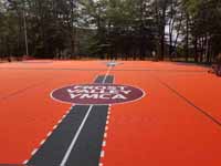 Frost Valley YMCA logo in middle of epic multiple game basketball court.